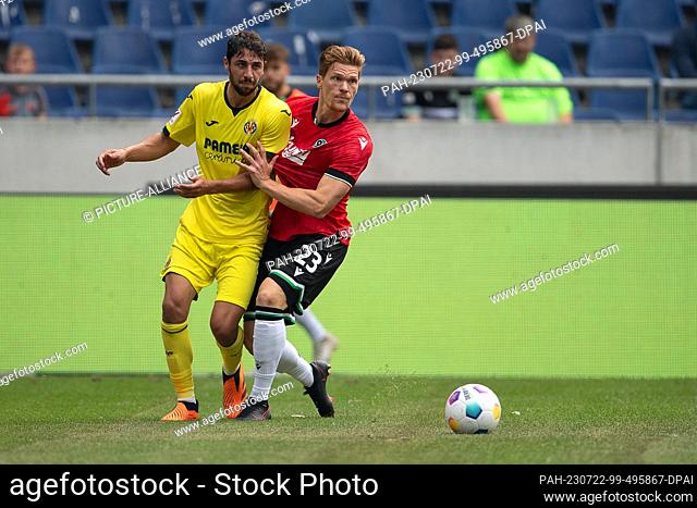 22 July 2023, Lower Saxony, Hanover: Soccer: Test matches, Hannover 96 - FC Villarreal at the Heinz-von-Heiden Arena. Hannover's Marcel Halstenberg (r) plays...