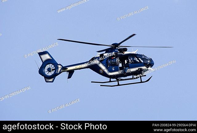 13 August 2020, France, Marseillan: A helicopter of the gendarmerie during an exercise on the beach in Marseillan Plage. Photo: Waltraud...