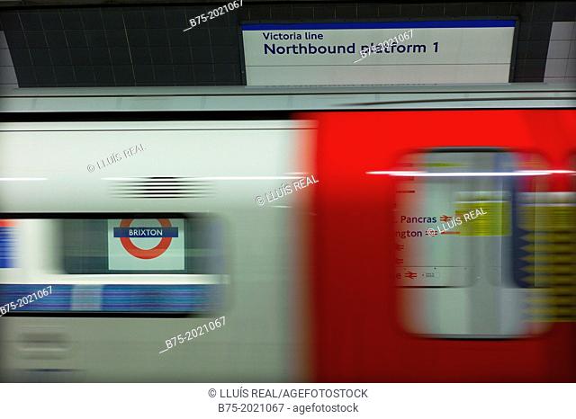 Train moving in Northbound platform in Brixton station, London, England, UK