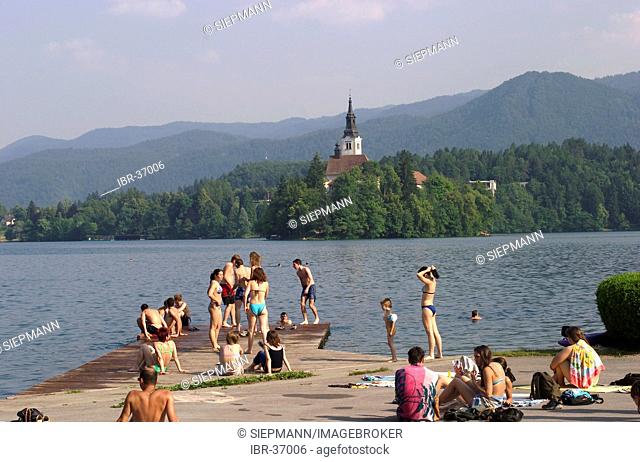 Beach at Lake Bled with St. Marie's Church on the iland - Slovenia