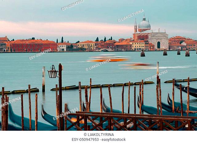 Venice, Italy. Gondolas and beautiful lamppost in the foreground. San Giorgio di Maggiore church on background