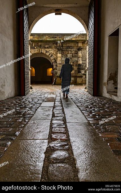 Helsingor, Denmark A woman walks through the entrance passage at the Royal Kronborg Castle famous for appearing in Shakespeare's Hamlet