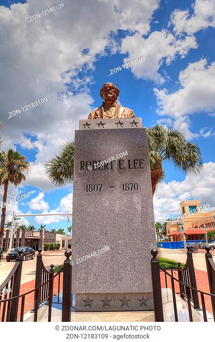 Fort Myers, Florida, USA ? June 7, 2018: Clouds form in a blue sky above the controversial Robert E. Lee monument in downtown Fort Myers, Florida