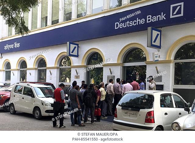A large crowd gathers outside a branch of the Deutsche Bank in New Delhi, India, 10 November 2016. The country's banks reopened for the first time in the wake...