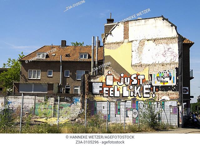 Graffiti wall with a test screen and a quote 'I just feel like!' in Eindhoven, The Netherlands, Europe