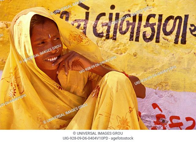 India. Portrait Of Woman In Yellow Sari