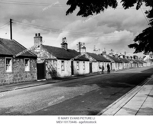 A row of single storey, stone built cottages at Ayr, Ayrshire, Scotland