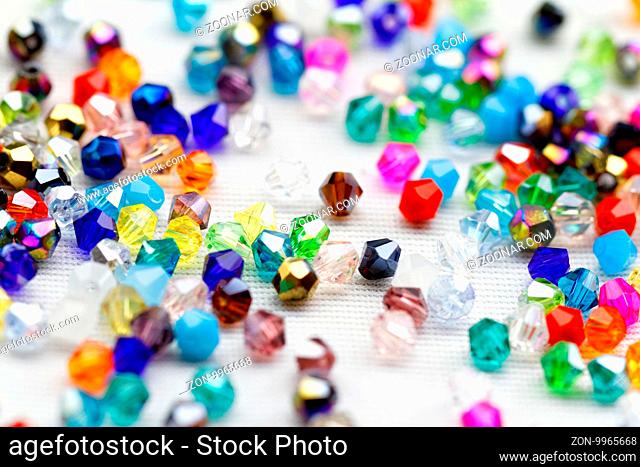 Beautiful glass beads closeup on white background