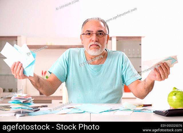 White bearded old man in budget planning concept
