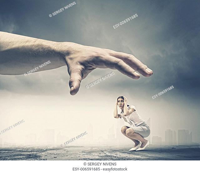 Big human hand catching businesswoman. Professional relations