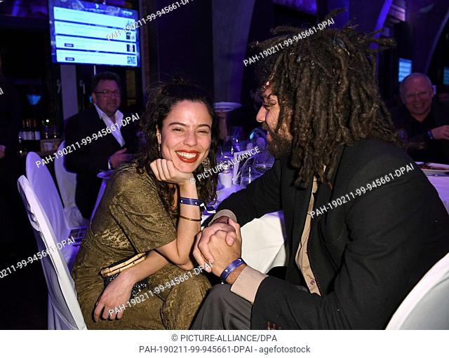 11 February 2019, Berlin: Noah Becker and his girlfriend Elizabeth Ehrlich sit at the same table at the ""Cinema for Peace Gala"" in the Westhafen Event &...