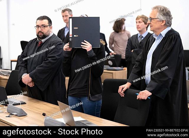 31 May 2023, Saxony, Dresden: The defendant Lina E. (M) stands in the courtroom during the continuation of the trial at the Dresden Higher Regional Court (OLG)...