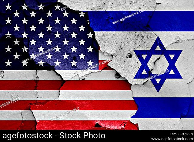 flags of United States and Israel painted on cracked wall
