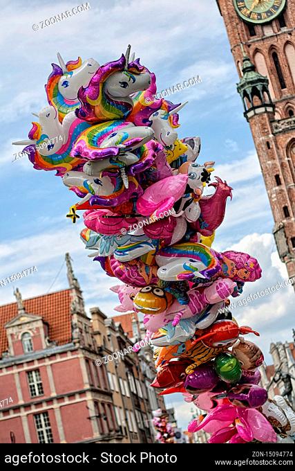 Colourfull folic baloons filled with helium picturing characters from tales, Gdansk D?uga street, Poland