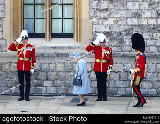 Queen Elizabeth II, accompanied by her cousin the Duke of Kent, attends a small Trooping the Colour Parade to mark her official birthday