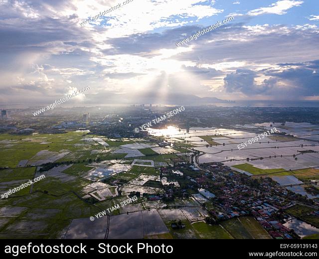 Aerial view magnificent sun ray over paddy field at Perai, Penang