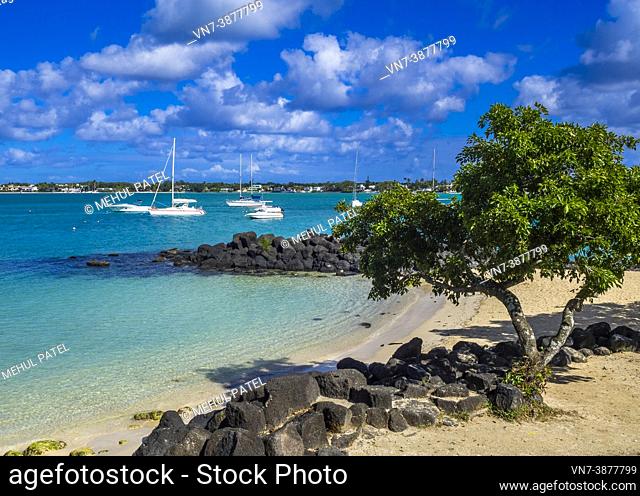 Secluded beach on Grand Baie, Mauritius. Grand Baie (or Grand Bay) is a seaside village and large tourist beach attraction in the district of Rivière du Rempart...