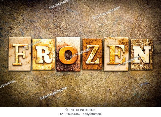 The word ""FROZEN"" written in rusty metal letterpress type on an old aged leather background