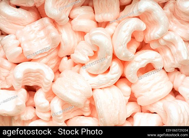 many soft polystyrene fill packaging particles background
