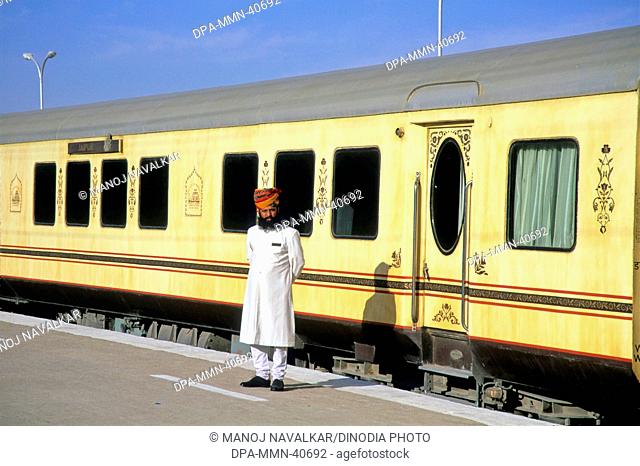 Trains Railways ; rajasthani attendent of palace on wheel ; jaislamer ; rajasthan ; india
