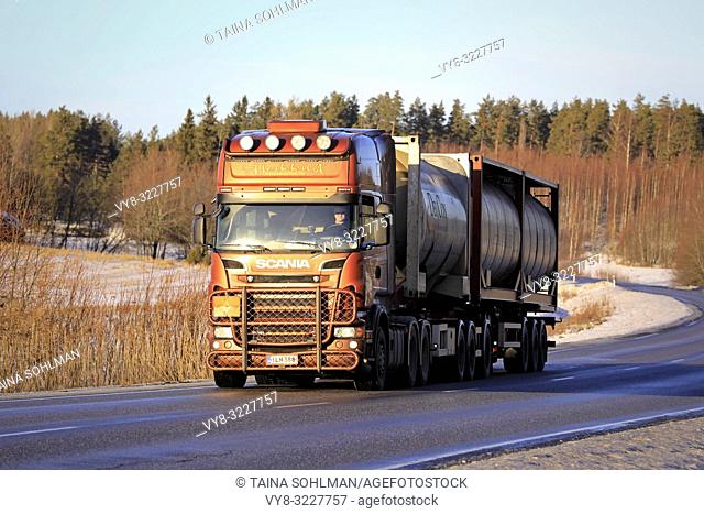 Salo, Finland - January 11, 2019: Bronze Scania R560 chemical transport truck of AH Trans Oy on the road on a winter afternoon in South of Finland