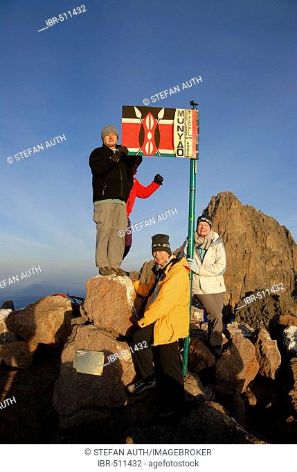 Group of mountaineerers at summit Point Lenana (4985 m) with Batian (5199 m) at the back Mount Kenya National Park Kenya