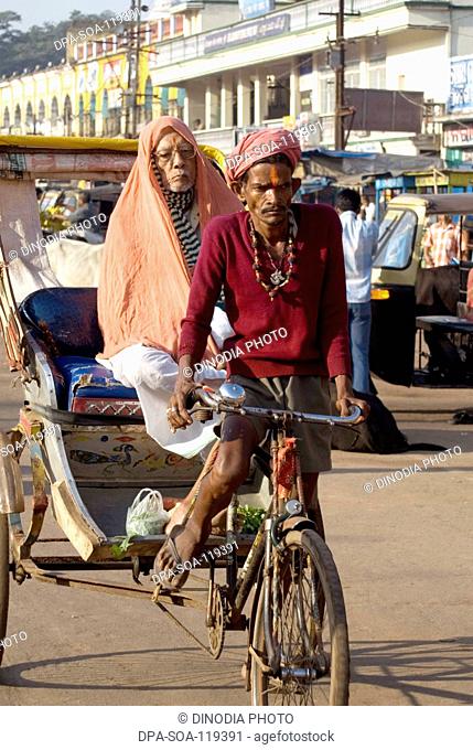 Bicycle rickshaw-puller at Puri ; Orissa ; India
