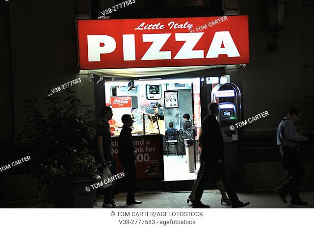 Pizza shop at night in New York City