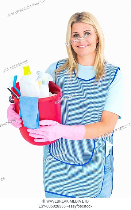 Cleaner woman holding a bucket in the white background