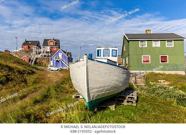 Brightly painted houses and boat in Sisimiut, Greenland