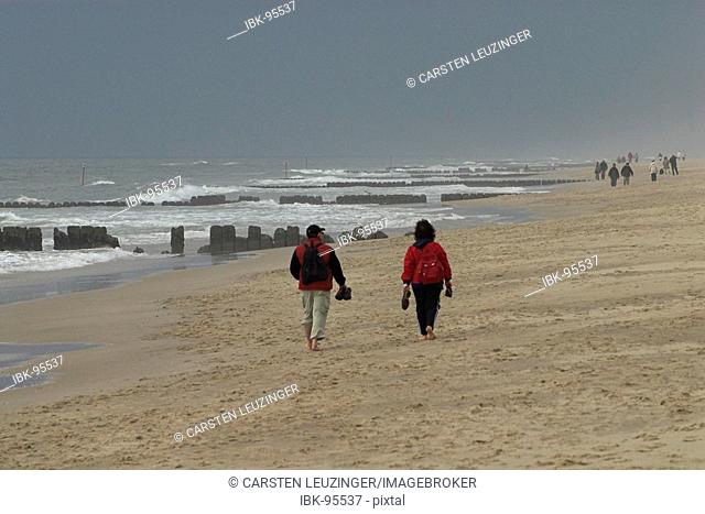 People walking at the beach at bad weather, Sylt, Schleswig Holstein, Germany