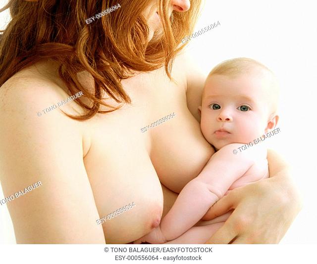 mother holding nude baby in arms on her breast