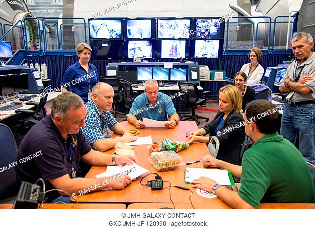 Expedition 3940 crew members, interpreters and various training personnel are pictured during an emergency scenario training session in the Space Vehicle...
