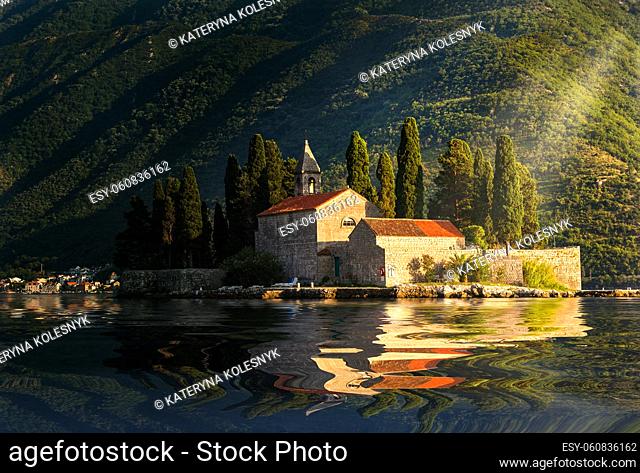 Sunbeams over Saint George monastery in Perast, Montenegro