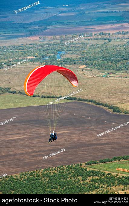 Paragliding in Altai mountains. Paragliders in fight in the mountains, concept of extreme sport activity