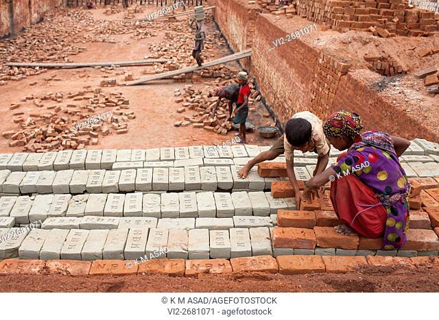 Babu (08) works at a brick factory with his mother in Narayangonj, Bangladesh, Jun 01, 2016. He come this place with his family member