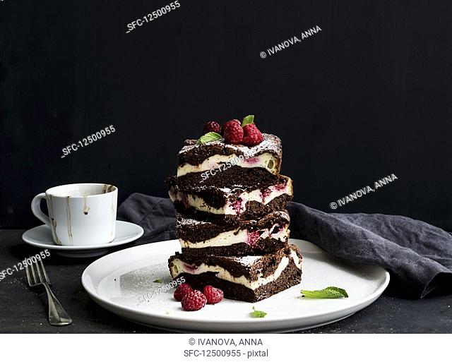 Brownies-cheesecake tower with raspberries