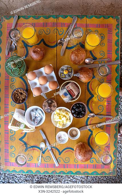 High angle view of traditional Moroccan breakfast on colorful table, Tighmert Oasis, Morocco