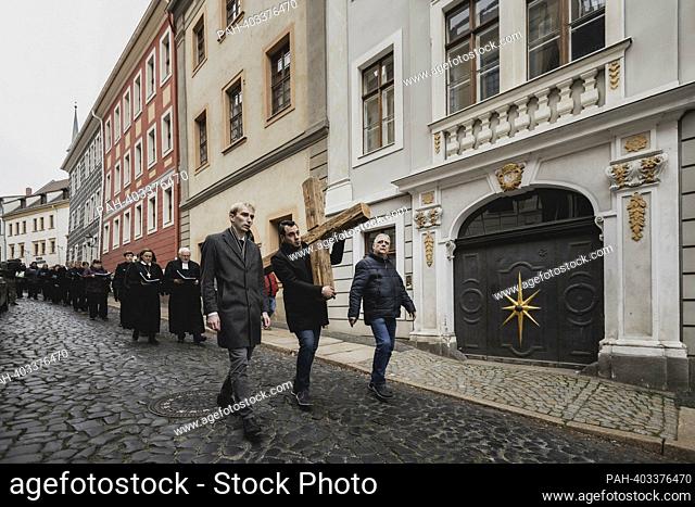 The cross is carried as part of the Way of the Cross from St. Peter's Church to the Holy Sepulcher in Goerlitz, April 7th, 2023