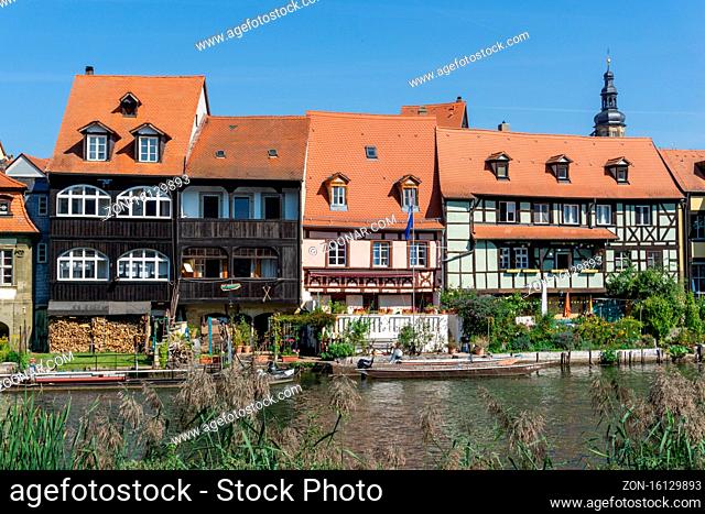 Bamberg, Bavaria / Germany - 15 September 2020: historic and colorful half-timbered houses on the banks of the Regnitz river in Bamberg in Bavaria