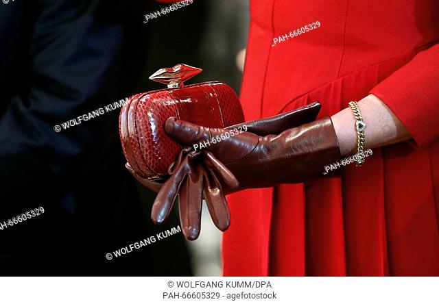 Queen Mathilde of Belgium holds her red handbag in her hands at Heidberg monastery in Eupen, Belgium, 10 March 2016. German President Joachim Gauck is on a...
