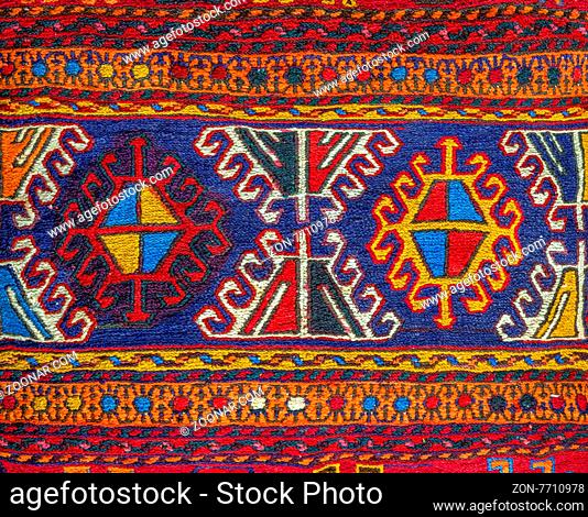 Colorful peruvian fabric style rug surface close up