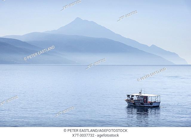 Early morning view of a hazy Mount Athos and the Athos peninsula, seen from the sea, Chalkidiki, Macedonia, Northern Greece