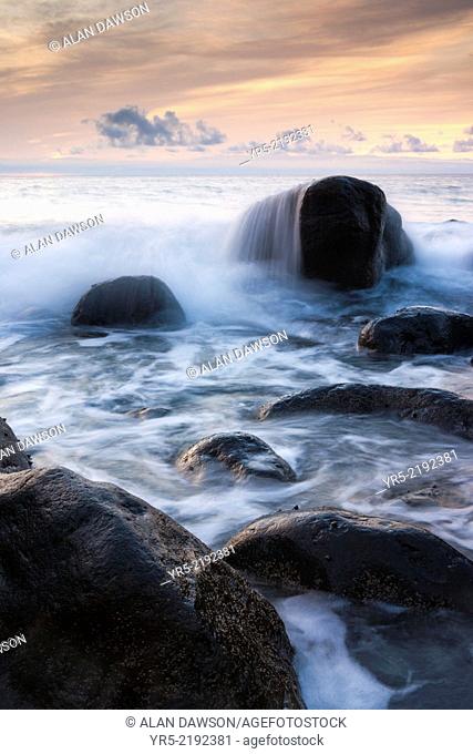 Wave breaking over rocks at sunset on north coast of Gran Canaria, Canary Islands, Spain
