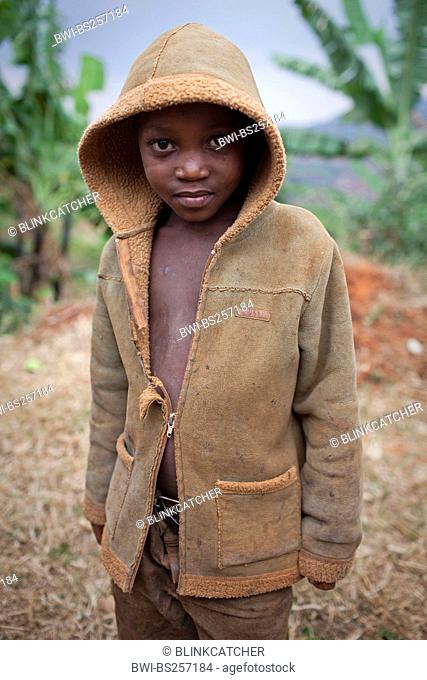 little boy in a hoodie sweater standing in front of banana plantation, Burundi, Karuzi, Karuzi