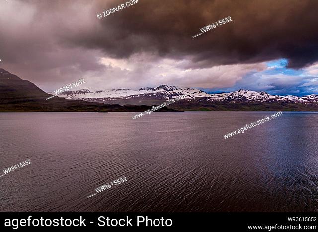 snowy mountains of the eastern fjords with an overcast sky on Iceland