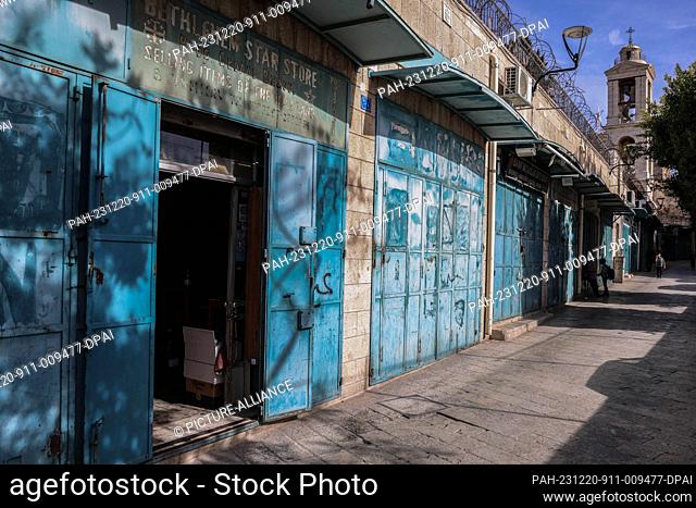 20 December 2023, Palestinian Territories, Bethlehem: A general view of closed Bethlehem souvenir shops, which are deserted after Christmas celebrations were...