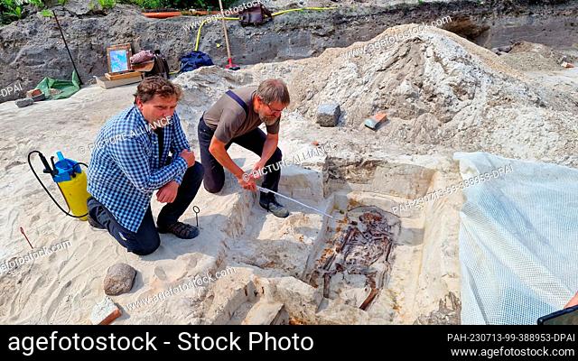 13 July 2023, Brandenburg, Brandenburg an der Havel: Excavation director Torsten Trebes (l) and Stefan Dalitz from the lower monument protection authority show...