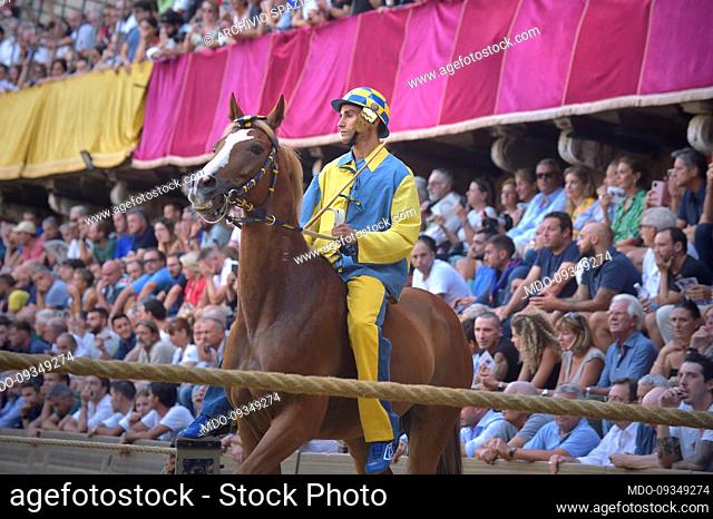 Jockeys compete at the historical horse race Palio di Siena 2022 The edition of the Assumption in Piazza del Campo. Siena (Italy), August 17th, 2022