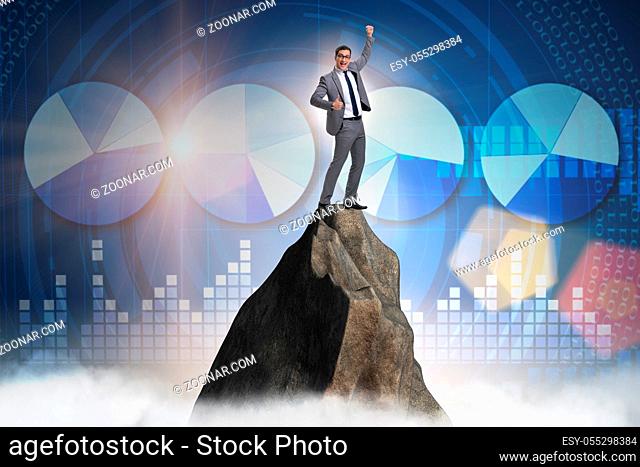 Businessman at the top of mountain